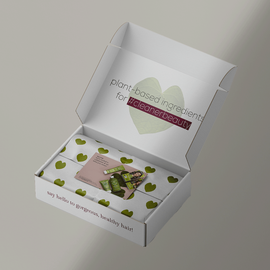 A fully branded influencer box for Naturtint USA including a branded mailer box, tissue paper, influencer card, and packaging tape.